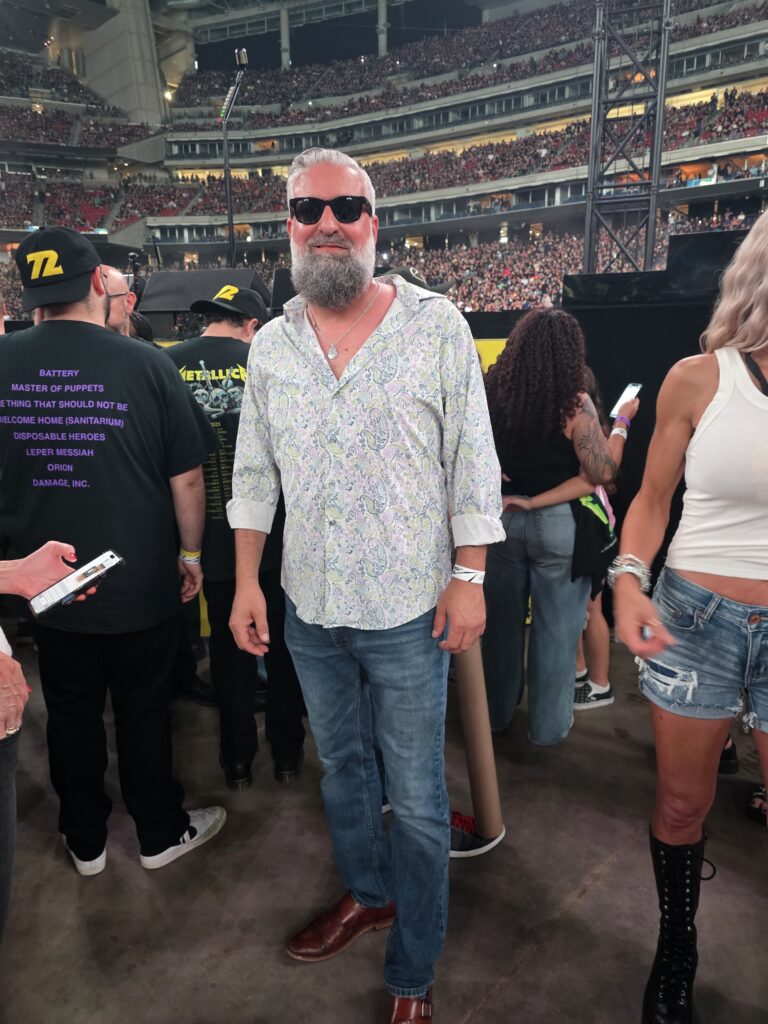 Heath Ledet attending a large live music concert at a stadium