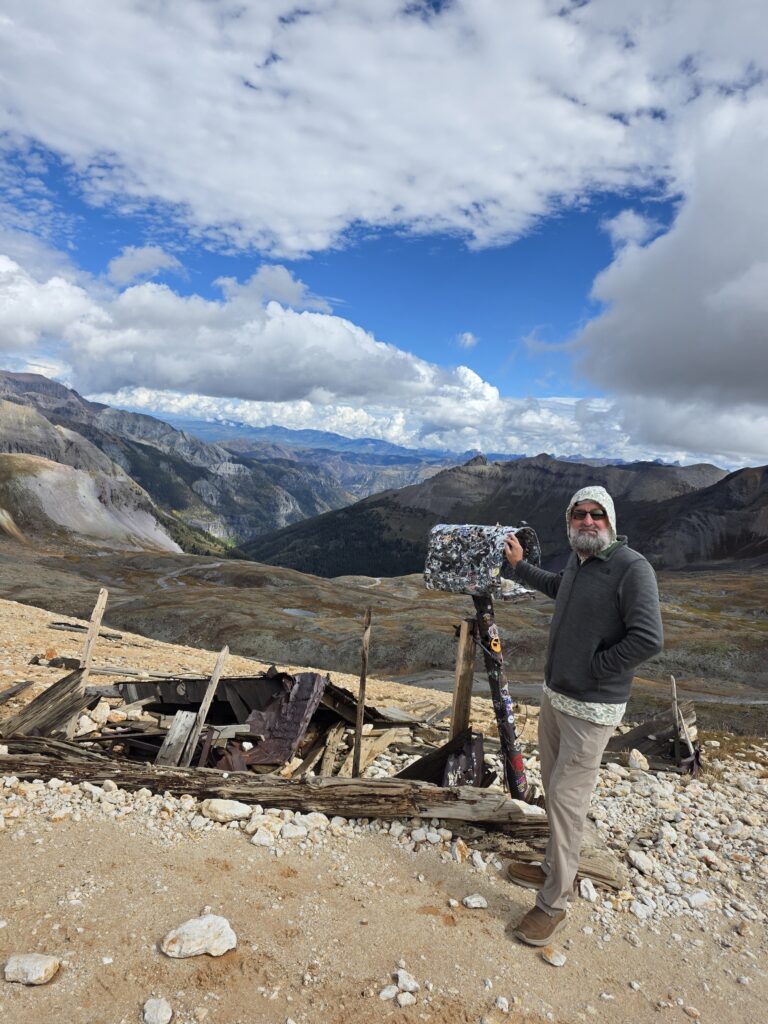 Heath Ledet exploring a scenic mountain landscape during an outdoor hike